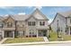 Charming two-story townhome with a well-maintained lawn and inviting front entrance at 2692 Pearl Ridge Trce, Buford, GA 30519