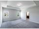 Sunlit primary bedroom with decorative tray ceiling and ensuite bathroom access at 2692 Pearl Ridge Trce, Buford, GA 30519
