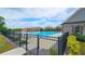 Community pool area with fences, seating and a splash fountain, perfect for relaxing on a sunny day at 2692 Pearl Ridge Trce, Buford, GA 30519