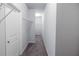 Spacious walk-in closet with shelving and carpeted floor at 2692 Pearl Ridge Trce, Buford, GA 30519