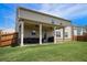 Spacious backyard with a covered patio, ceiling fans and ample space for outdoor activities at 320 Conley Ave, Hampton, GA 30228