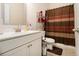 Cozy bathroom with a shower-tub combination and modern white vanity at 320 Conley Ave, Hampton, GA 30228