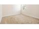 Cozy bedroom with neutral carpet and natural light from the window at 320 Conley Ave, Hampton, GA 30228