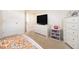 Bedroom featuring plush carpeting, dresser, and closet at 320 Conley Ave, Hampton, GA 30228