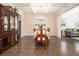 Cozy dining room with hardwood floors, a chandelier, and an antique china cabinet at 320 Conley Ave, Hampton, GA 30228