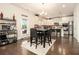 Bright kitchen featuring stainless steel appliances, an island with counter seating, and ample cabinet space at 320 Conley Ave, Hampton, GA 30228