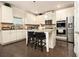 Modern kitchen with stainless appliances, granite counters, and a functional center island at 320 Conley Ave, Hampton, GA 30228