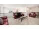 Loft area with plush red seating and view of lower level at 320 Conley Ave, Hampton, GA 30228