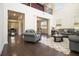 Bright living room with hardwood floors, high ceilings, and comfortable seating arrangement at 320 Conley Ave, Hampton, GA 30228