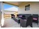Inviting covered patio with wicker furniture, perfect for outdoor relaxation at 320 Conley Ave, Hampton, GA 30228