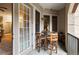 Balcony featuring an outdoor dining set and views of the neighborhood at 3621 Vinings Slope Se # 1231, Atlanta, GA 30339