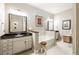Elegant bathroom with double sinks, a soaking tub, and a stylish design at 3621 Vinings Slope Se # 1231, Atlanta, GA 30339