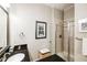 Well-lit bathroom featuring granite countertops, a tiled shower, and modern finishes at 3621 Vinings Slope Se # 1231, Atlanta, GA 30339