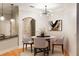 Stylish dining area with modern chandelier, round table, and hardwood floors at 3621 Vinings Slope Se # 1231, Atlanta, GA 30339