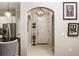 Inviting entryway with tile floors, art decorations, and a view into the kitchen area at 3621 Vinings Slope Se # 1231, Atlanta, GA 30339