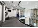 Modern gym with glass walls, exercise equipment, and a mezzanine level at 3621 Vinings Slope Se # 1231, Atlanta, GA 30339