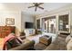 Comfortable living room with balcony access and a mounted television at 3621 Vinings Slope Se # 1231, Atlanta, GA 30339