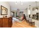 Bright living room features a breakfast bar, hardwood floors, and balcony access at 3621 Vinings Slope Se # 1231, Atlanta, GA 30339