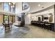 Spacious lounge area with a bar, seating, and large windows at 3621 Vinings Slope Se # 1231, Atlanta, GA 30339