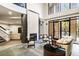 Inviting lounge area with a fireplace, comfortable seating, and access to a balcony at 3621 Vinings Slope Se # 1231, Atlanta, GA 30339