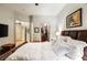 Comfortable main bedroom features a walk-in closet and stylish décor at 3621 Vinings Slope Se # 1231, Atlanta, GA 30339