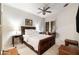 Spacious main bedroom with a ceiling fan, ample natural light, and a comfortable bed at 3621 Vinings Slope Se # 1231, Atlanta, GA 30339