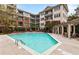 Inviting swimming pool with lounge chairs and beautiful landscaping at 3621 Vinings Slope Se # 1231, Atlanta, GA 30339