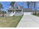 Charming two-story home with a front porch and attached two-car garage at 1001 Pine Ridge Dr, Stone Mountain, GA 30087