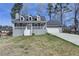 Charming two-story home with a front porch and attached two-car garage at 1001 Pine Ridge Dr, Stone Mountain, GA 30087