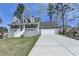 Charming two-story home with a front porch and attached two-car garage at 1001 Pine Ridge Dr, Stone Mountain, GA 30087