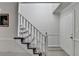 Foyer with carpeted stairs and a white door leading to other areas of the home at 1001 Pine Ridge Dr, Stone Mountain, GA 30087