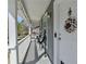 View of the front porch, with seating and a decorative wreath on the front door at 1001 Pine Ridge Dr, Stone Mountain, GA 30087