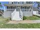 Inviting front porch with white railings and steps leading to the front door at 1001 Pine Ridge Dr, Stone Mountain, GA 30087