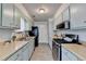 Spacious kitchen features ample counter space, stainless steel appliances, and natural lighting at 1001 Pine Ridge Dr, Stone Mountain, GA 30087