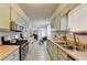 Bright kitchen features wood countertops, stainless steel appliances, and a charming breakfast nook at 1001 Pine Ridge Dr, Stone Mountain, GA 30087