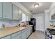 Charming kitchen featuring blue cabinets, butcher block countertops, and a bright, airy feel at 1001 Pine Ridge Dr, Stone Mountain, GA 30087