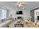 Comfortable living room featuring a fireplace, ceiling fan, and cozy seating at 1001 Pine Ridge Dr, Stone Mountain, GA 30087