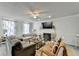 Comfortable living room featuring a fireplace, ceiling fan, and cozy seating at 1001 Pine Ridge Dr, Stone Mountain, GA 30087