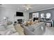 Cozy living room with a fireplace, ceiling fan, and comfortable seating arrangement at 1001 Pine Ridge Dr, Stone Mountain, GA 30087