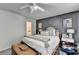 Inviting bedroom with a plush bed, a stylish accent wall, and a peek into the ensuite bathroom at 1001 Pine Ridge Dr, Stone Mountain, GA 30087