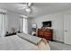 Bright, carpeted bedroom features a dresser, a TV, and light-filled windows at 1001 Pine Ridge Dr, Stone Mountain, GA 30087