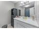 Well-lit bathroom features a vanity with storage space, complemented by neutral wall tones and clean finishes at 1610 Turtle Pond Dr, Hoschton, GA 30548