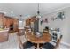 Bright kitchen featuring an island, stainless steel appliances and breakfast table by the window at 1610 Turtle Pond Dr, Hoschton, GA 30548