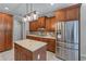 Lovely kitchen featuring stainless steel appliances, granite countertops, and an island at 1610 Turtle Pond Dr, Hoschton, GA 30548