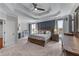 Spacious main bedroom with tray ceilings, fireplace, and ample natural light at 1610 Turtle Pond Dr, Hoschton, GA 30548