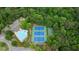 Overhead view of the community pool, tennis courts, and basketball court surrounded by lush trees at 1955 Piedmont Cove Ln, Cumming, GA 30040