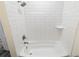 Bathroom showcasing tile-surround shower, bathtub, and brushed nickel shower head and faucet at 1955 Piedmont Cove Ln, Cumming, GA 30040
