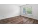 Bedroom featuring wood floors and natural light at 1955 Piedmont Cove Ln, Cumming, GA 30040