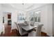 Well-lit dining area with neutral decor and open access to other living spaces at 1955 Piedmont Cove Ln, Cumming, GA 30040