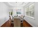 Elegant dining room featuring a modern chandelier and bright windows at 1955 Piedmont Cove Ln, Cumming, GA 30040